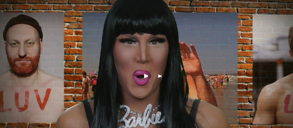 Screenshot aus Charlie Hides’ Madonna-Parodie von 2012 mit Charlie Hides in der Mitte und Ingos LUV-Foto mit rotem Bart links im Bild.
